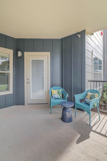 Balcony with a blue chair 